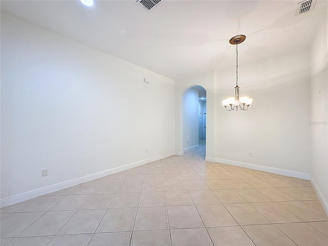 101 Flame Vine Way, Groveland, FL 34736 - spare room with arched walkways, a chandelier, and light tile patterned flooring