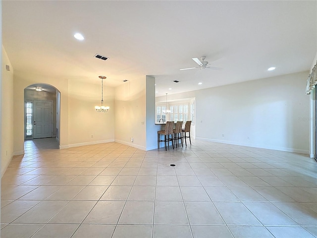 101 Flame Vine Way, Groveland, FL 34736 - spare room with a ceiling fan, recessed lighting, light tile patterned floors, arched walkways, and a chandelier