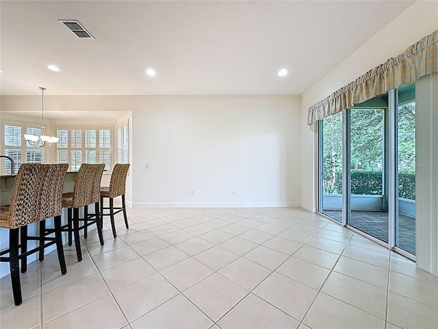 101 Flame Vine Way, Groveland, FL 34736 - dining area with plenty of natural light, a chandelier, recessed lighting, and light tile patterned floors