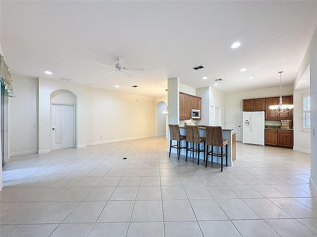 101 Flame Vine Way, Groveland, FL 34736 - dining area featuring a ceiling fan, light tile patterned floors, recessed lighting, arched walkways, and a chandelier