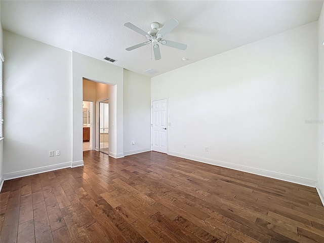 101 Flame Vine Way, Groveland, FL 34736 - spare room with dark wood finished floors and a ceiling fan