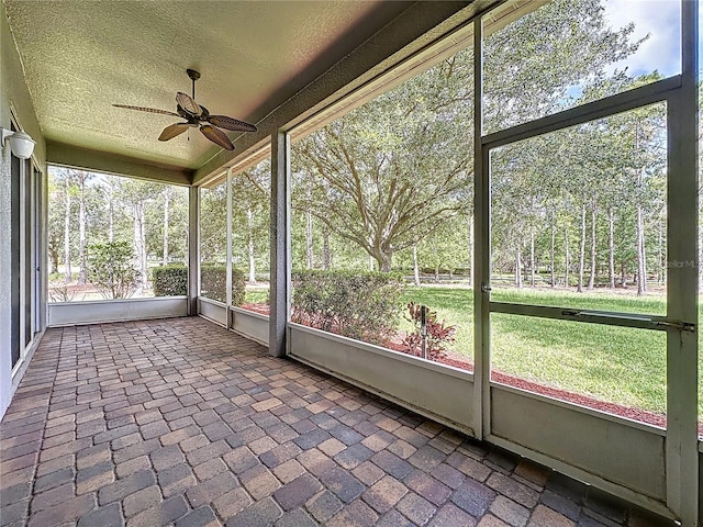 101 Flame Vine Way, Groveland, FL 34736 - unfurnished sunroom featuring a ceiling fan