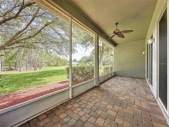 101 Flame Vine Way, Groveland, FL 34736 - unfurnished sunroom with ceiling fan