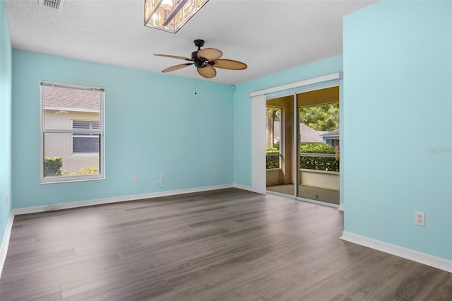3586 Eversholt St, Clermont, FL 34711 - empty room featuring a ceiling fan, wood finished floors, and a textured ceiling