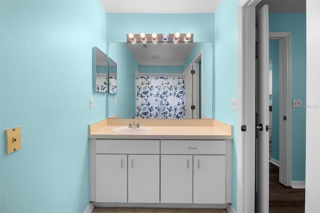 3586 Eversholt St, Clermont, FL 34711 - bathroom with vanity, wood finished floors, and curtained shower