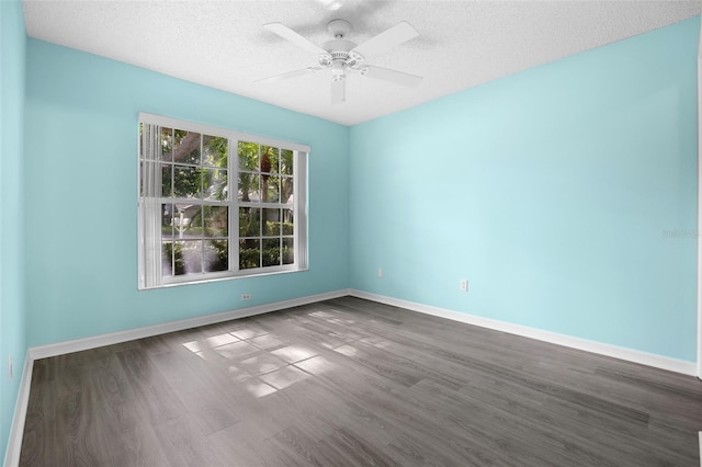 3586 Eversholt St, Clermont, FL 34711 - spare room with dark wood finished floors, a textured ceiling, and ceiling fan