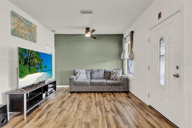 520 Dora Ave, Tavares, FL 32778 - entrance foyer with wood finished floors and ceiling fan