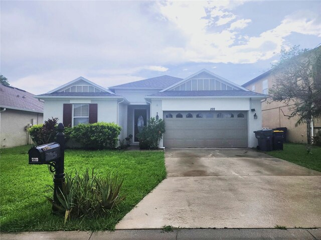 222 Bacopa Pass, Davenport, FL 33897 - ranch-style home featuring a front yard, an attached garage, driveway, and stucco siding