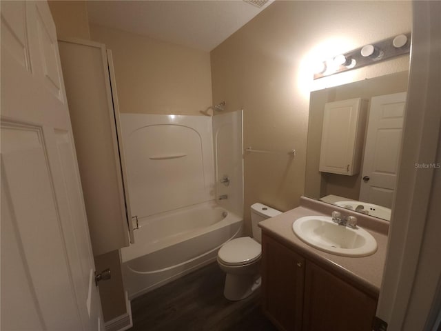 222 Bacopa Pass, Davenport, FL 33897 - bathroom with vanity, tub / shower combination, and wood finished floors