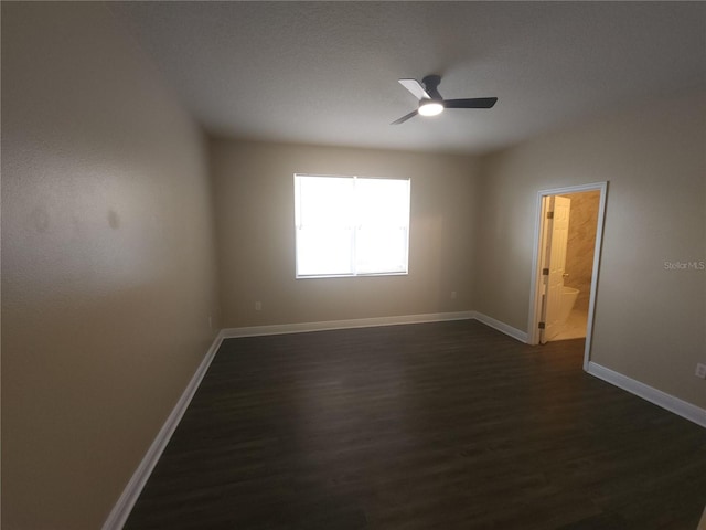 222 Bacopa Pass, Davenport, FL 33897 - empty room featuring dark wood-style floors and ceiling fan