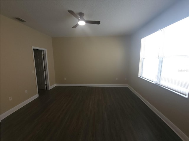 222 Bacopa Pass, Davenport, FL 33897 - empty room with dark wood-type flooring and ceiling fan