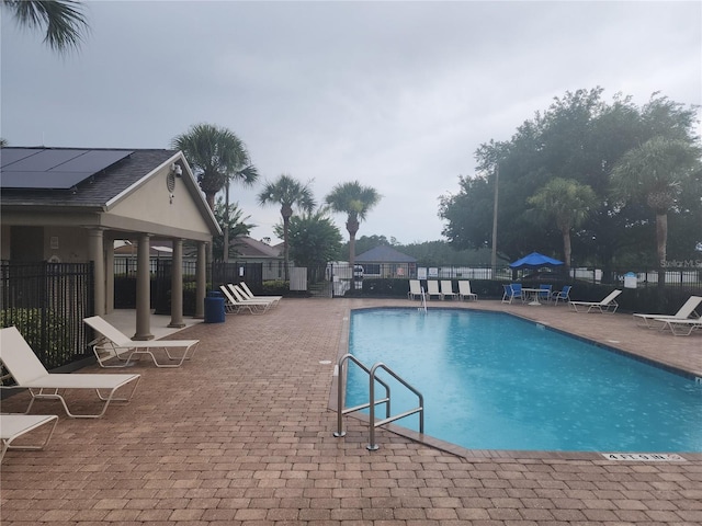 222 Bacopa Pass, Davenport, FL 33897 - community pool featuring a patio area
