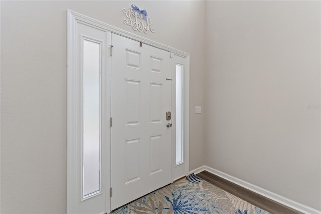 562 Meadow Ridge Dr, Saint Augustine, FL 32092 - foyer with dark wood-type flooring and baseboards
