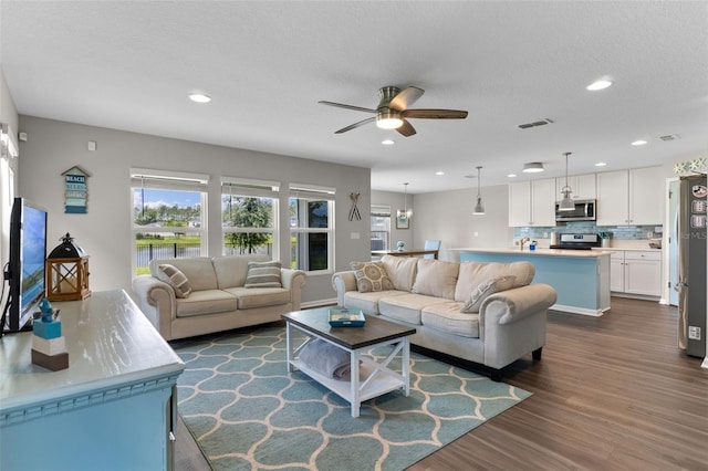 562 Meadow Ridge Dr, Saint Augustine, FL 32092 - living room with a ceiling fan, dark wood-type flooring, and recessed lighting