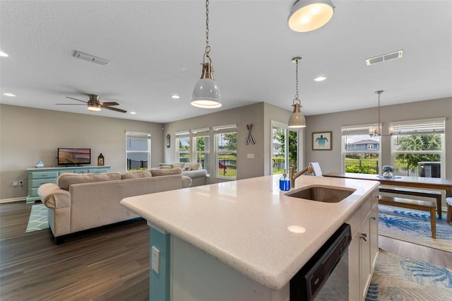 562 Meadow Ridge Dr, Saint Augustine, FL 32092 - kitchen featuring black dishwasher, dark wood-style flooring, recessed lighting, white cabinets, and decorative light fixtures