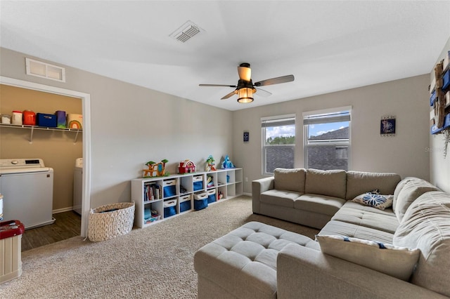 562 Meadow Ridge Dr, Saint Augustine, FL 32092 - carpeted living room featuring independent washer and dryer and a ceiling fan