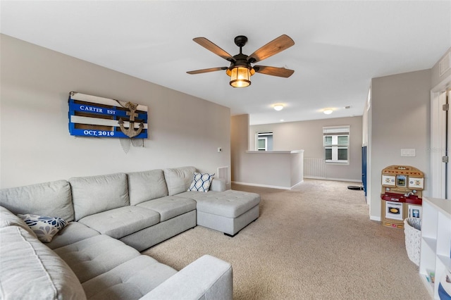 562 Meadow Ridge Dr, Saint Augustine, FL 32092 - carpeted living area with a ceiling fan and baseboards