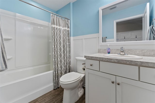 562 Meadow Ridge Dr, Saint Augustine, FL 32092 - full bath featuring vanity, wainscoting, shower / tub combo with curtain, wood finished floors, and a decorative wall