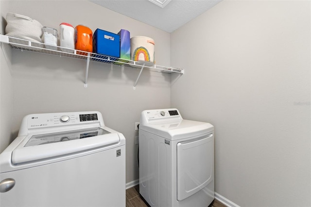 562 Meadow Ridge Dr, Saint Augustine, FL 32092 - laundry area with independent washer and dryer and dark wood-style floors