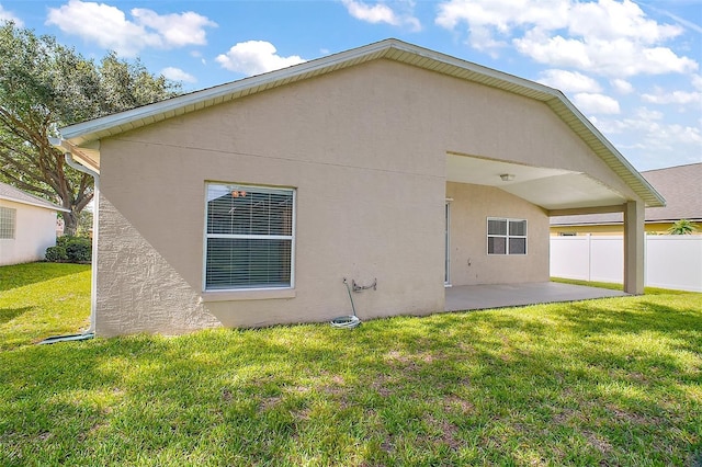 33234 Kaylee Way, Leesburg, FL 34788 - back of property featuring a patio and stucco siding