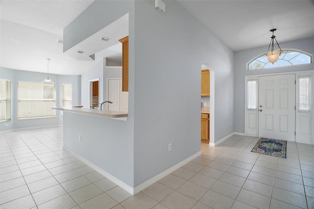 33234 Kaylee Way, Leesburg, FL 34788 - foyer with light tile patterned floors, arched walkways, and lofted ceiling