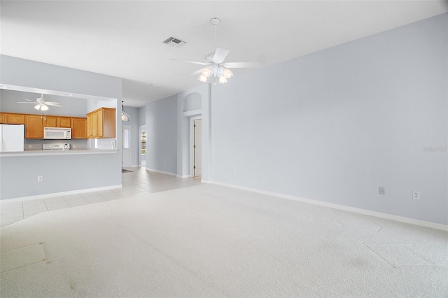 33234 Kaylee Way, Leesburg, FL 34788 - unfurnished living room featuring ceiling fan, light carpet, and light tile patterned flooring
