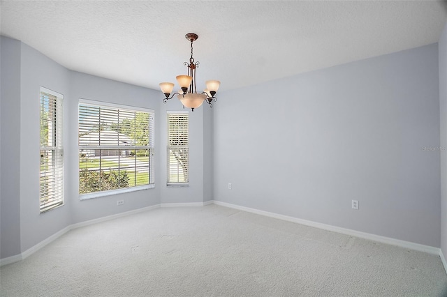 33234 Kaylee Way, Leesburg, FL 34788 - empty room featuring a chandelier and light carpet