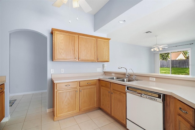 33234 Kaylee Way, Leesburg, FL 34788 - kitchen with white dishwasher, ceiling fan, light countertops, and light tile patterned floors