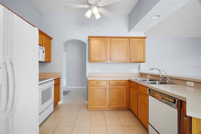 33234 Kaylee Way, Leesburg, FL 34788 - kitchen with white appliances, arched walkways, a ceiling fan, light countertops, and light tile patterned flooring