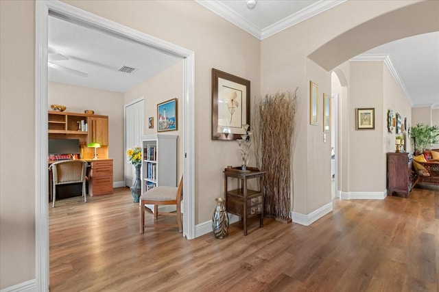 4210 Arlington Ridge Blvd, Leesburg, FL 34748 - hallway featuring arched walkways, light wood finished floors, and ornamental molding