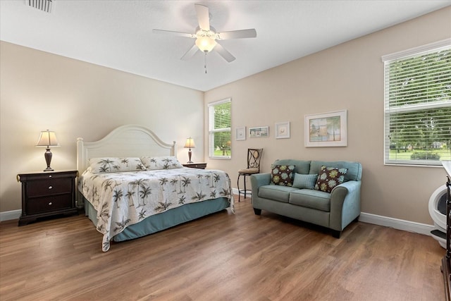 4210 Arlington Ridge Blvd, Leesburg, FL 34748 - bedroom featuring multiple windows, wood finished floors, and ceiling fan
