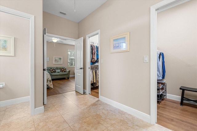 4210 Arlington Ridge Blvd, Leesburg, FL 34748 - hall featuring baseboards and light tile patterned flooring
