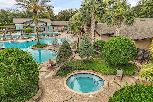 4210 Arlington Ridge Blvd, Leesburg, FL 34748 - community pool with a hot tub and a patio