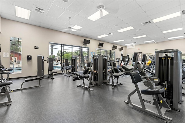 4210 Arlington Ridge Blvd, Leesburg, FL 34748 - exercise room featuring a paneled ceiling and healthy amount of natural light
