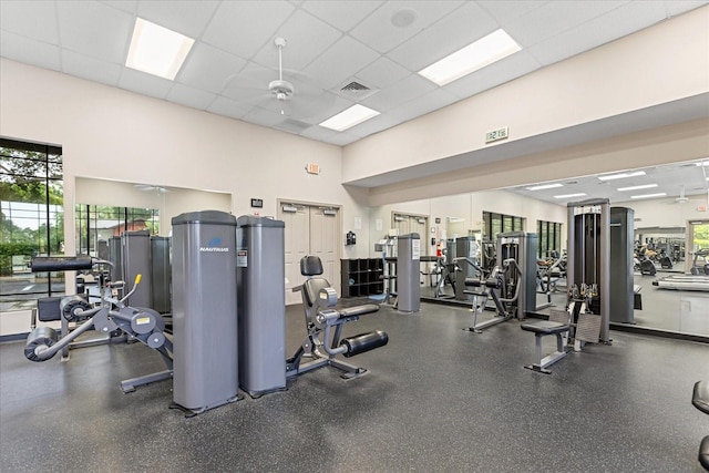 4210 Arlington Ridge Blvd, Leesburg, FL 34748 - exercise room featuring plenty of natural light, a towering ceiling, and a drop ceiling