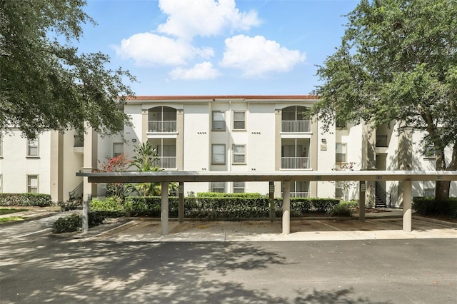 2639 Maitland Crossing Way Unit 102, Orlando, FL 32810 - view of building exterior with covered parking