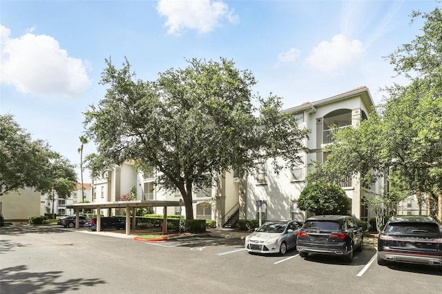 2639 Maitland Crossing Way Unit 102, Orlando, FL 32810 - view of building exterior with uncovered parking