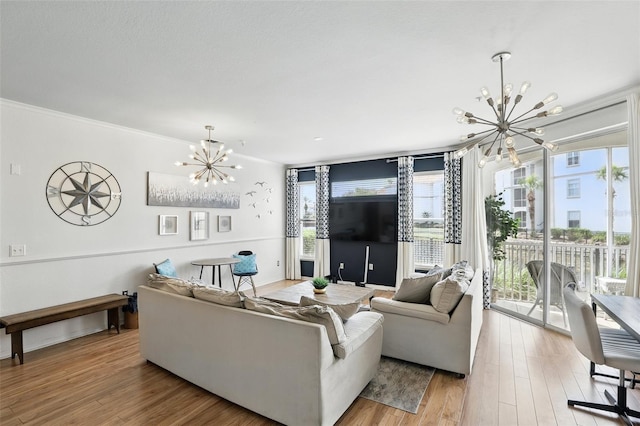2639 Maitland Crossing Way Unit 102, Orlando, FL 32810 - living area with a chandelier, healthy amount of natural light, and ornamental molding
