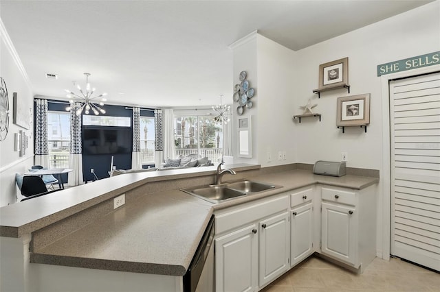 2639 Maitland Crossing Way Unit 102, Orlando, FL 32810 - kitchen with a chandelier, dishwasher, light tile patterned floors, and white cabinetry