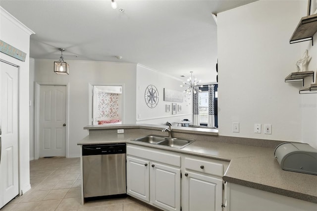 2639 Maitland Crossing Way Unit 102, Orlando, FL 32810 - kitchen featuring stainless steel dishwasher, a peninsula, crown molding, white cabinetry, and light tile patterned flooring