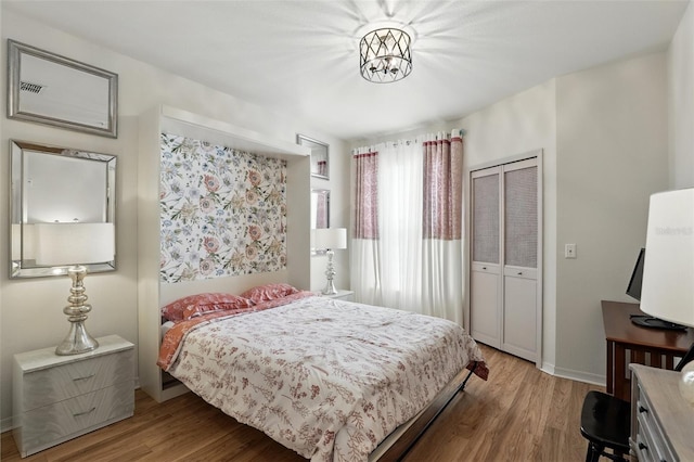 2639 Maitland Crossing Way Unit 102, Orlando, FL 32810 - bedroom with wood finished floors and a closet