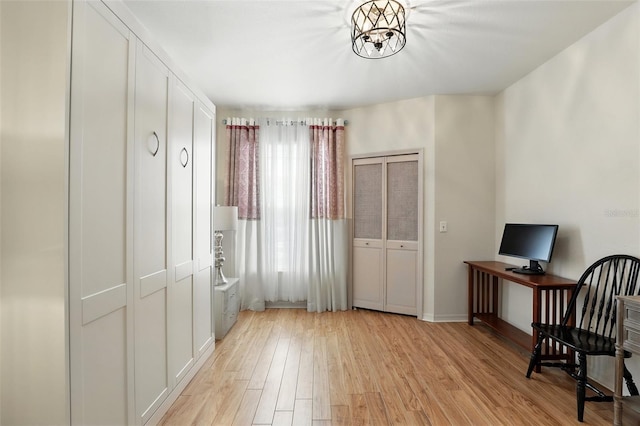 2639 Maitland Crossing Way Unit 102, Orlando, FL 32810 - office featuring light wood finished floors and a chandelier