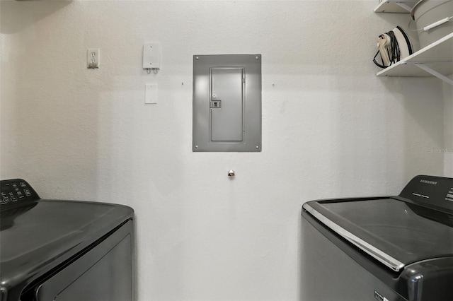 2639 Maitland Crossing Way Unit 102, Orlando, FL 32810 - laundry room featuring electric panel and washer and dryer
