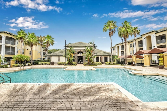 2639 Maitland Crossing Way Unit 102, Orlando, FL 32810 - community pool with a patio area and a residential view