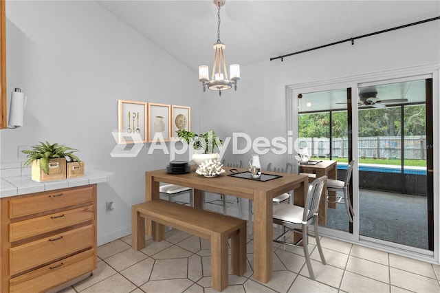 204 Lori Ct, Umatilla, FL 32784 - dining area featuring a chandelier, light tile patterned floors, and lofted ceiling