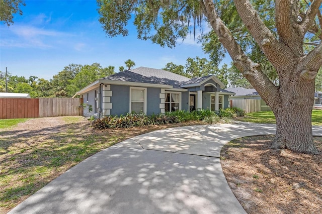 204 Lori Ct, Umatilla, FL 32784 - single story home with roof with shingles, stucco siding, and concrete driveway