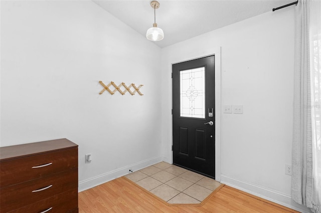 204 Lori Ct, Umatilla, FL 32784 - entryway featuring vaulted ceiling and light wood finished floors