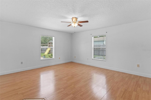 204 Lori Ct, Umatilla, FL 32784 - spare room with healthy amount of natural light, a ceiling fan, light wood-style floors, and a textured ceiling