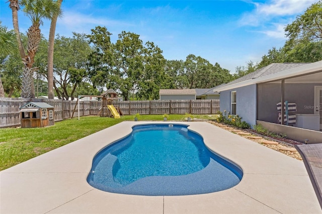 204 Lori Ct, Umatilla, FL 32784 - view of pool with a fenced backyard, a playground, and a sunroom