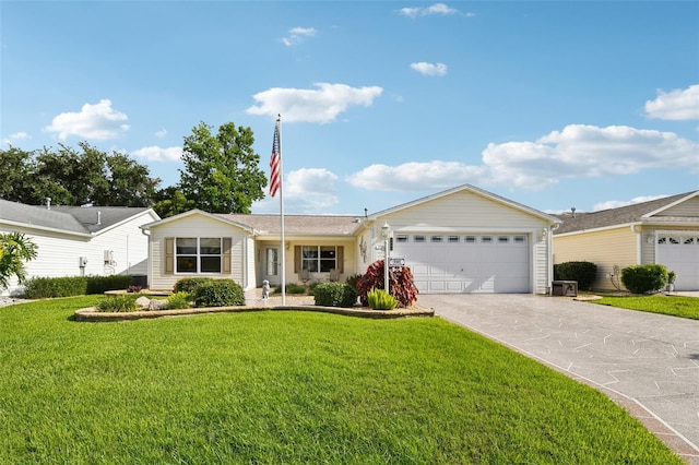3460 Idlewood Loop, The Villages, FL 32162 - ranch-style home with a garage, a front yard, and driveway